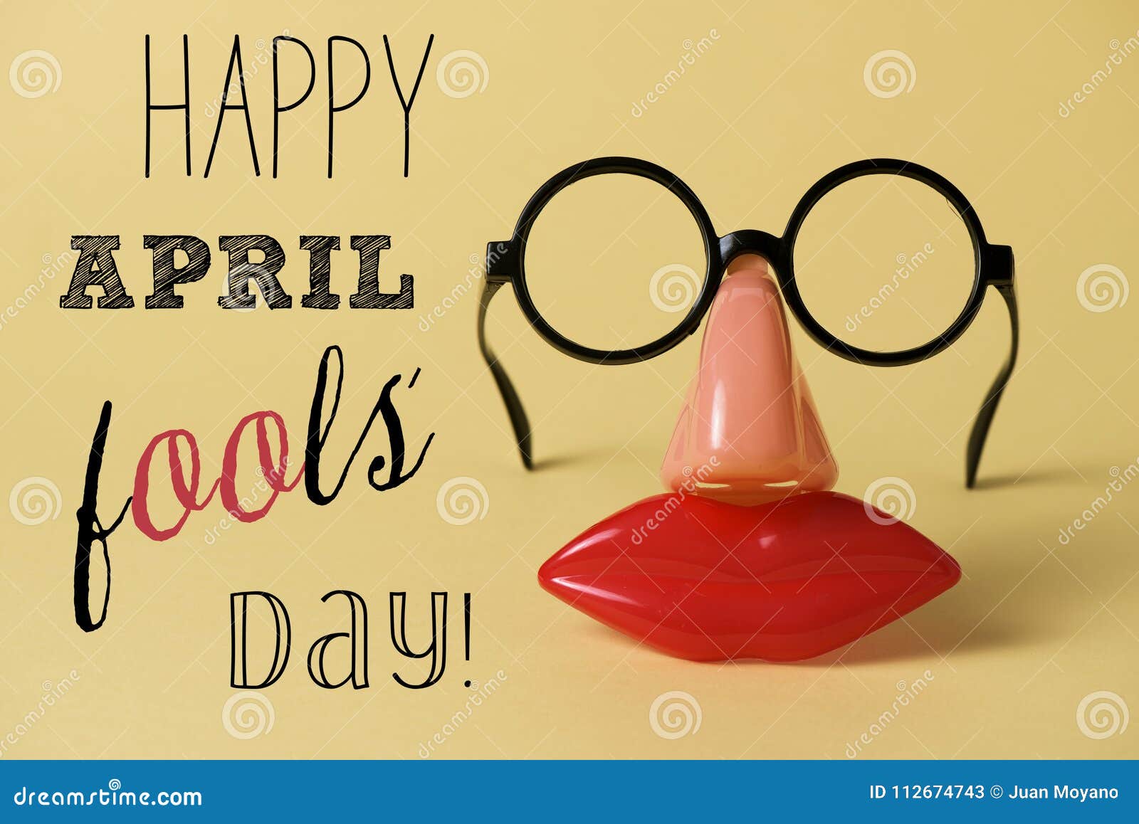 novelty glasses and text happy april fools day