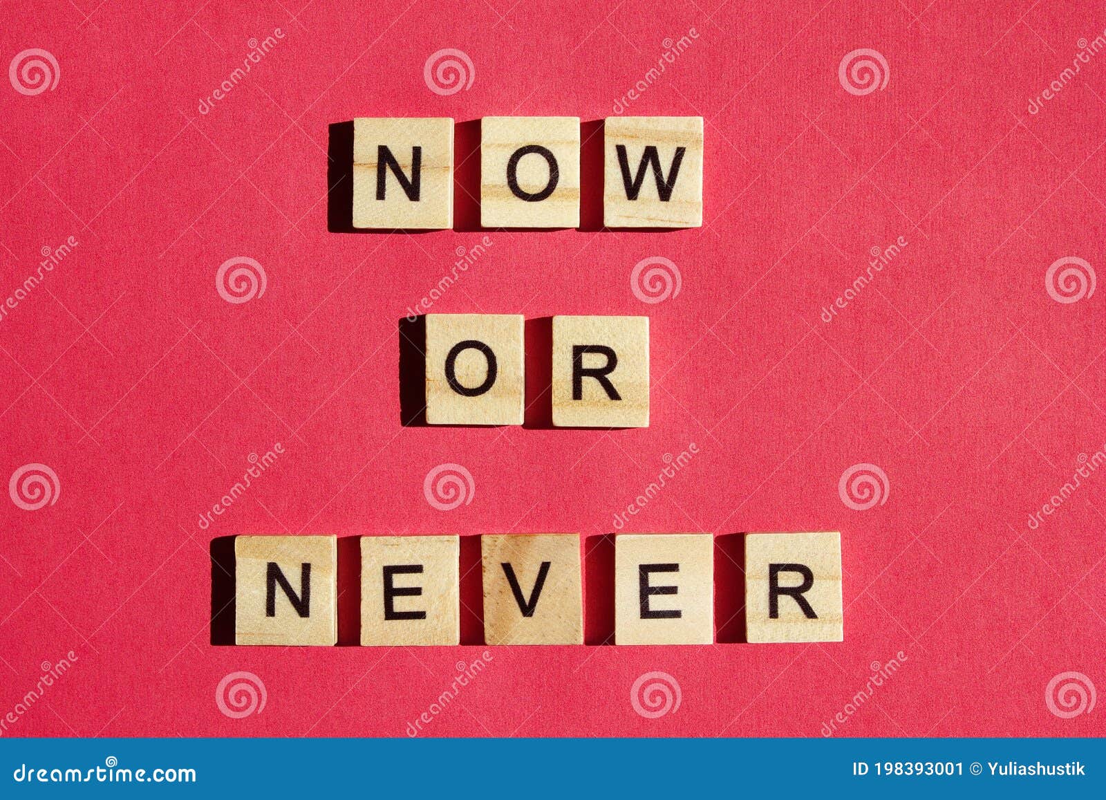 now or never - the motivating inscription is laid out on a red background with wooden blocks with black letters. call to action