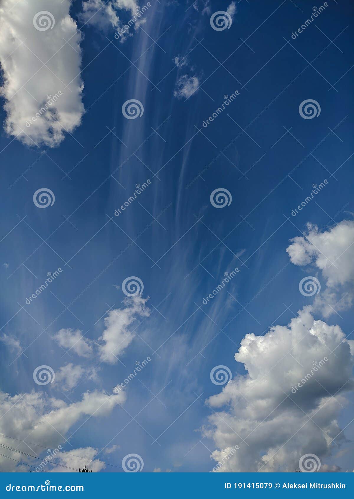 Noyabrsk, Russia - May 30, 2020: Blue Sky with White Clouds. Vertical
