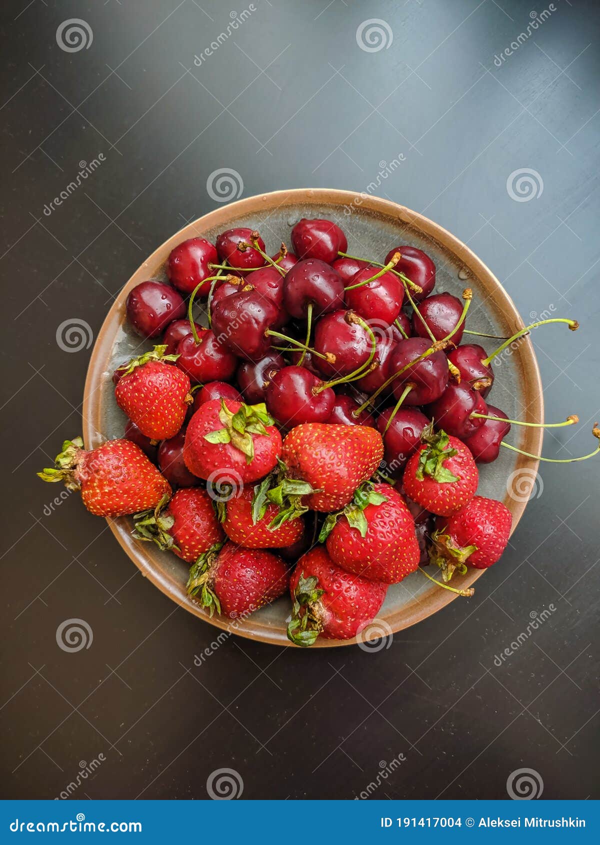 Noyabrsk, Russia - May 30, 2020: Red Strawberries and Cherries on a