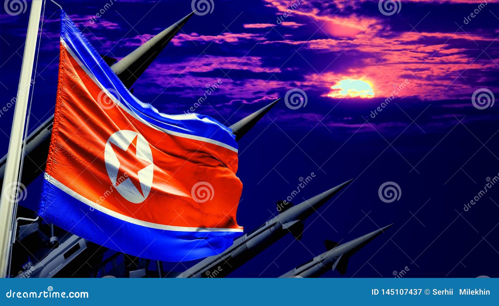 north korea flag and nuclear missiles on sunset sky background