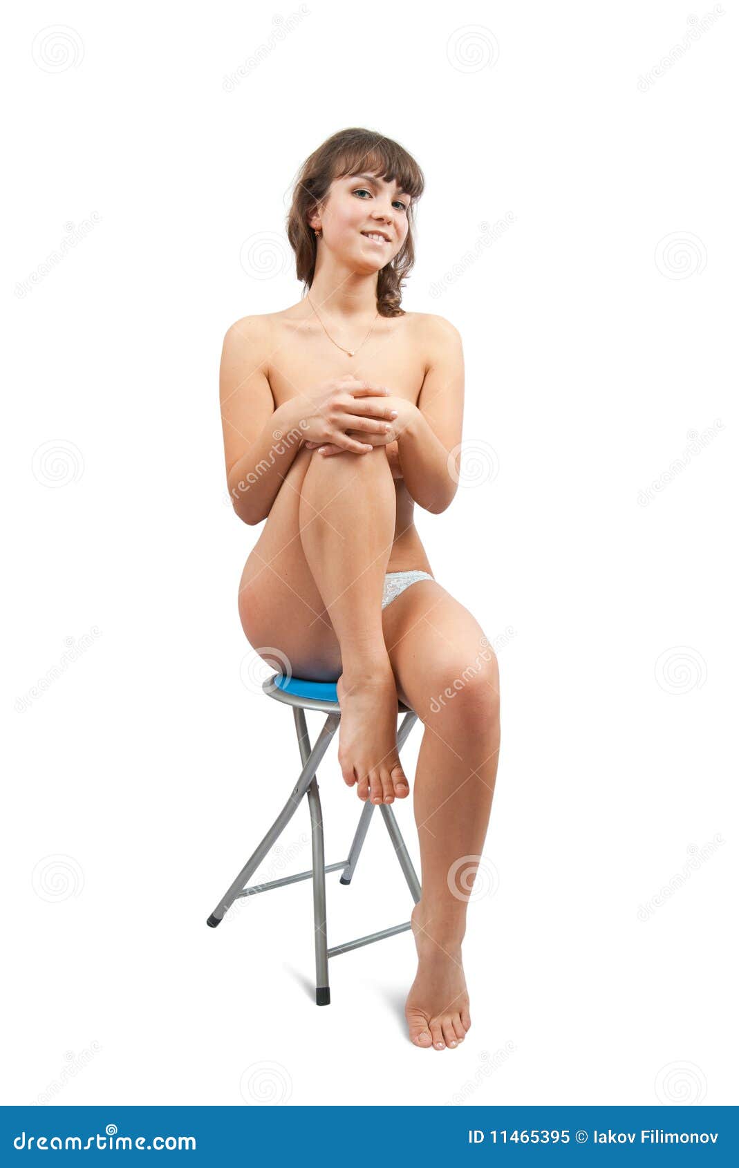 Nude girl sitting on stool. 
