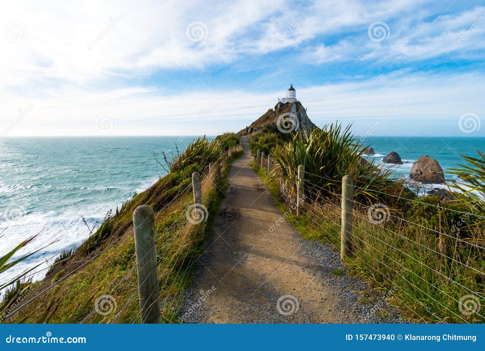 nugget point, rocks cliffs, and beautiful ocean. a path to lighthouse. the catlins, new zealand. i