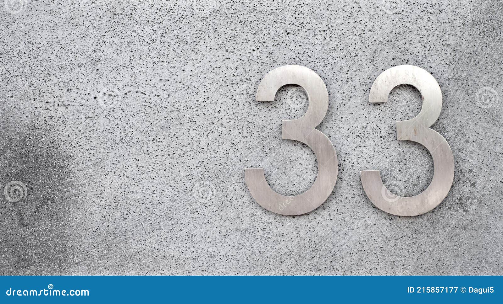 number 33, thirty-three, silver metalic digits on gray background.