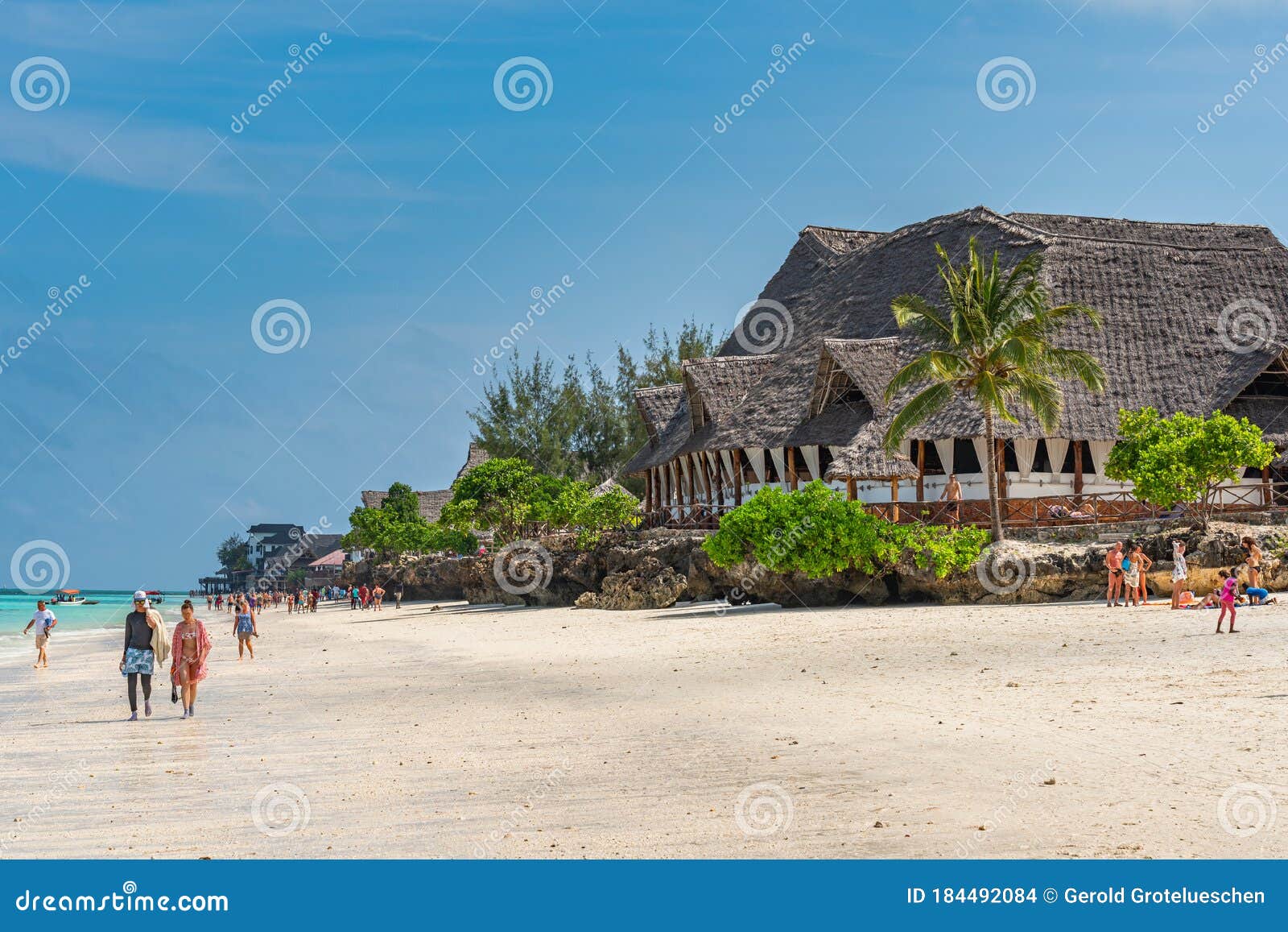 People At The Tropical White Beach Of Zanzibar Island Tanzania Eastern Africa Turquoise Ocean Blue Cloudy Sky Editorial Stock Image Image Of 2020 Coastline 184492084