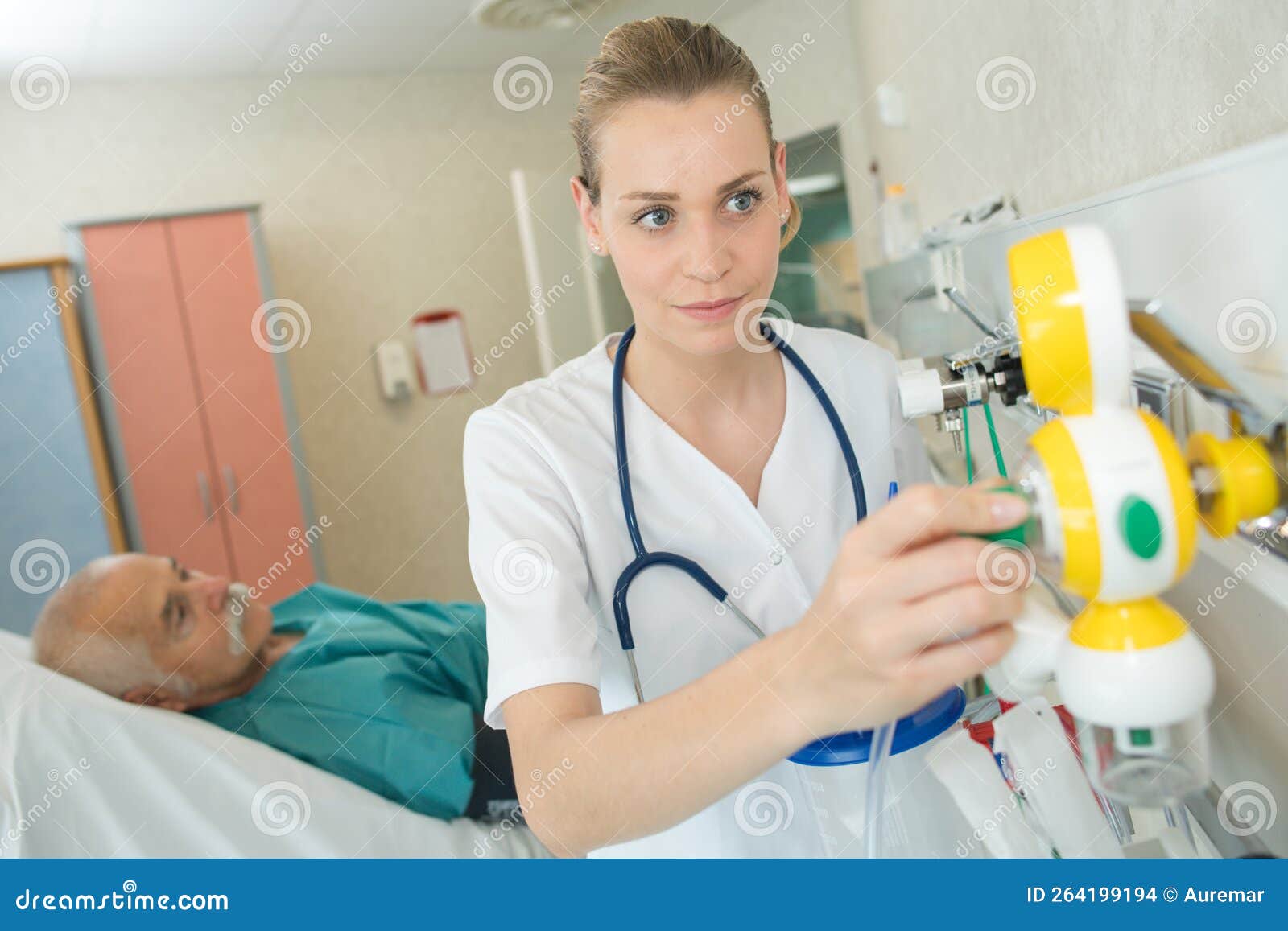 Nurse adjusting equipment stock photo. Image of dosage 264199194