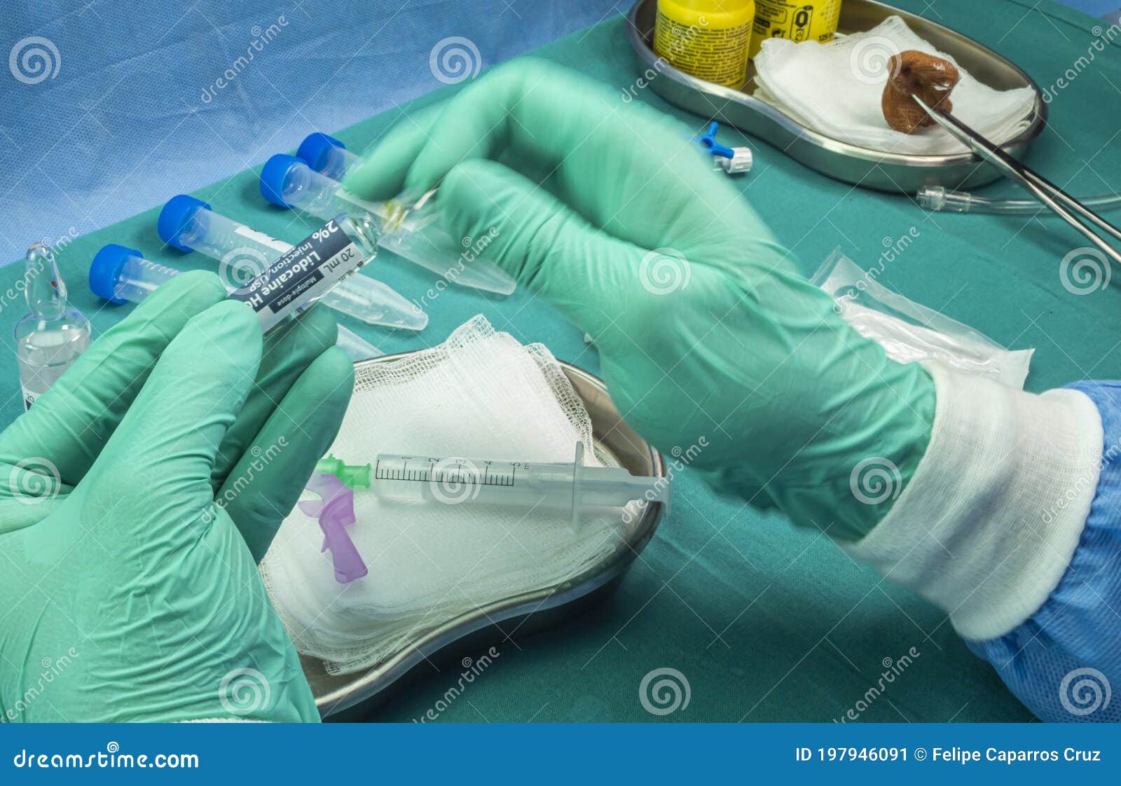nurse breaks anesthesia vial, preparation to extract cerebrospinal fluid to investigate causes in a person affected by transverse