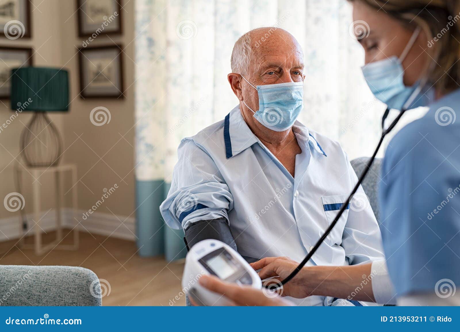nurse checking patient blood pressure at eldercare centre