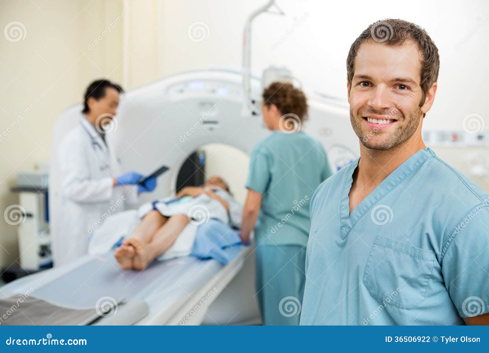 Nurse With Colleague And Doctor Preparing Patient Stock