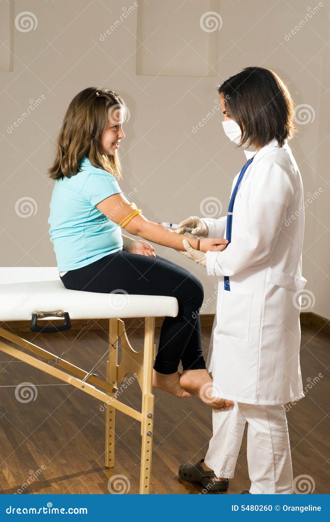 A Nurse Drawing Blood from a Girl Vertical Stock Photo Image of