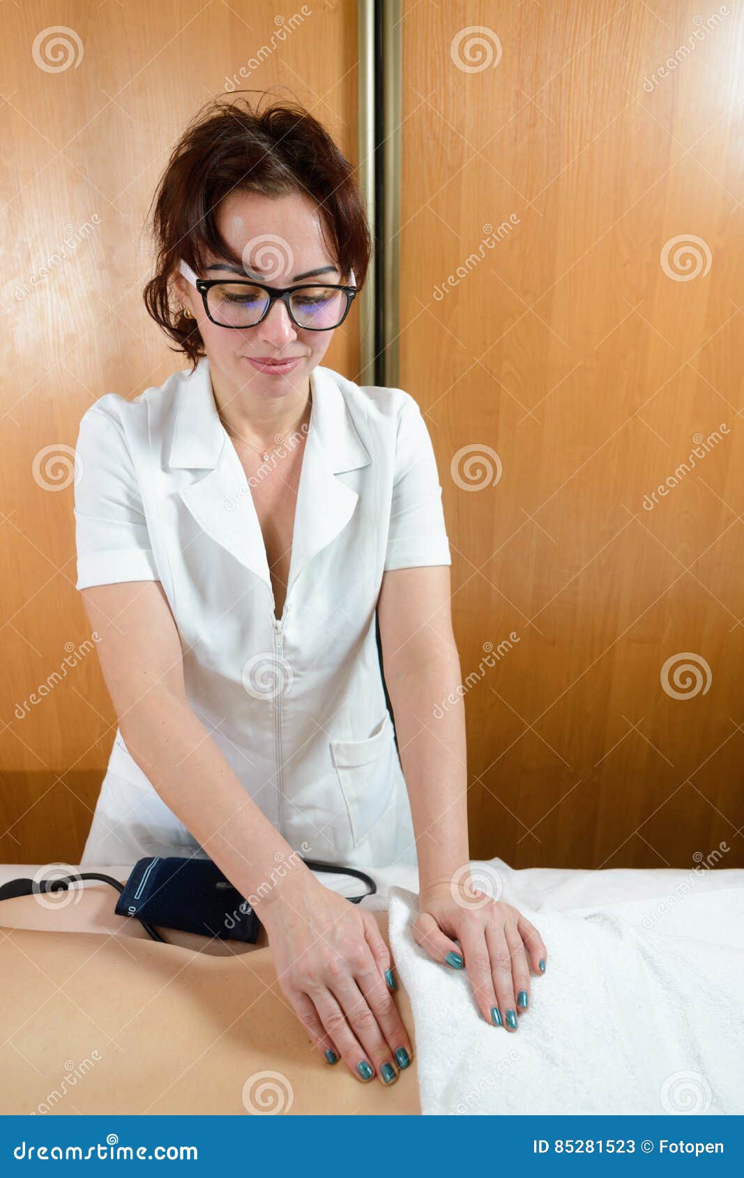 Nurse in Glasses Measures the Pressure Stock Image Image of