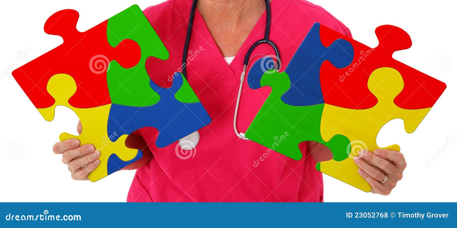 Nurse Holding Two Puzzle Pieces Representing Autism Awareness Stock