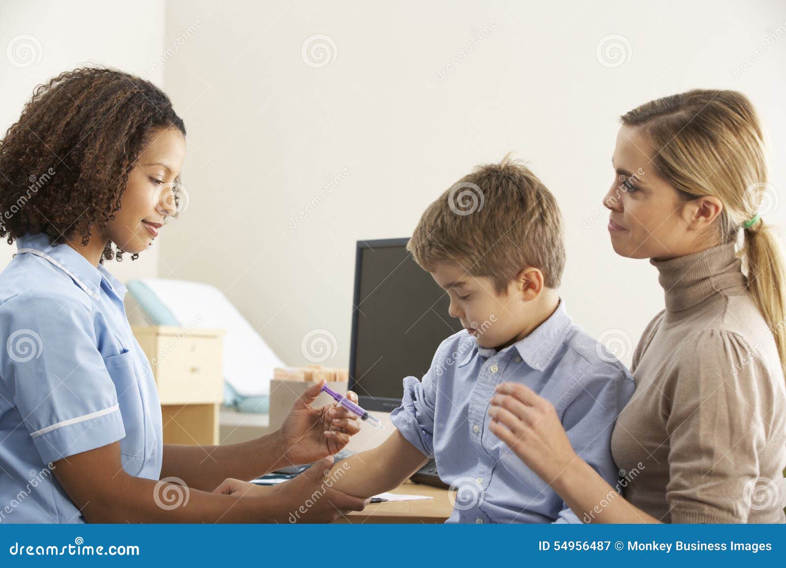 nurse injecting child with mother