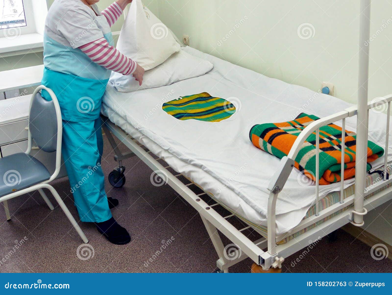 Nurse makes the bed stock image. Image of people, assisted 158202763