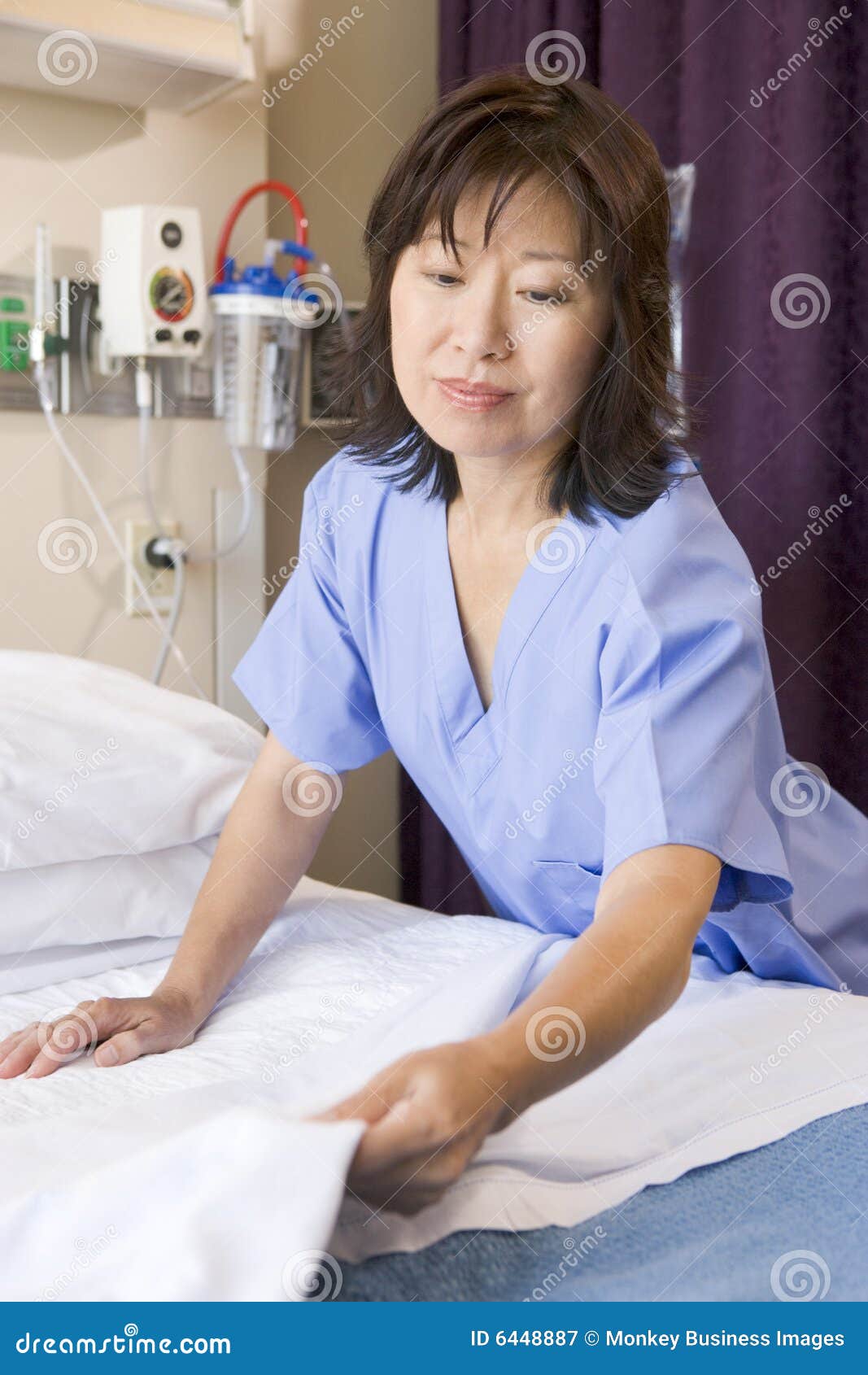 A Nurse Making a Bed stock image. Image of assistance 6448887