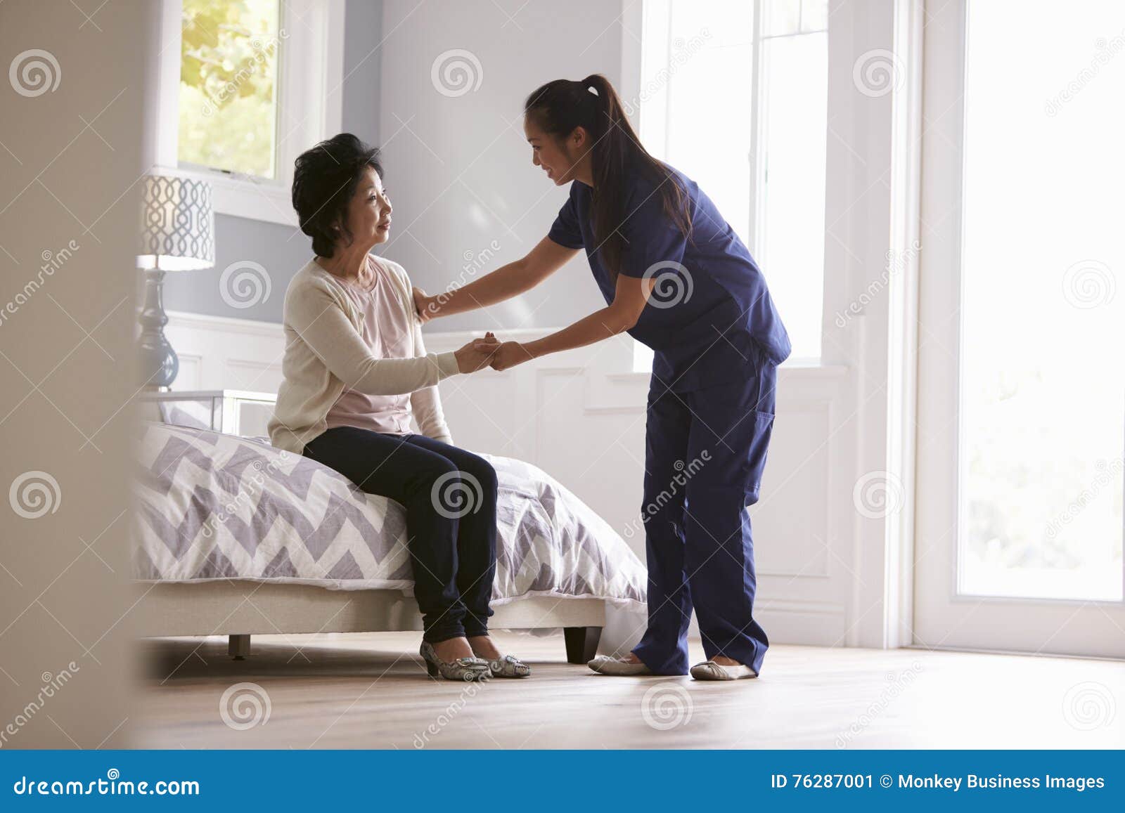 nurse making home visit to senior woman