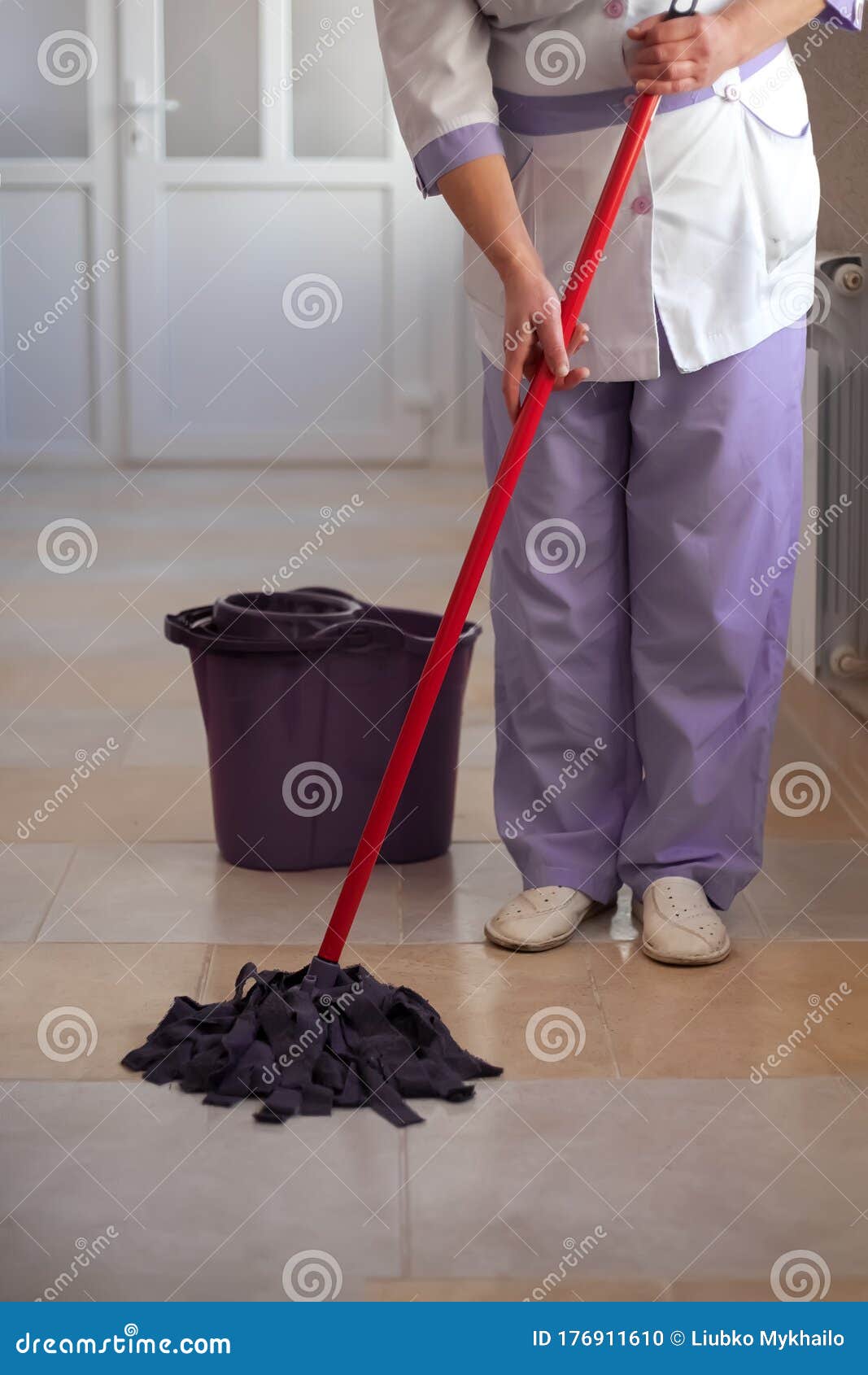 A Nurse Mops the Floor in a Hospital Stock Photo - Image of colour, home:  176911610