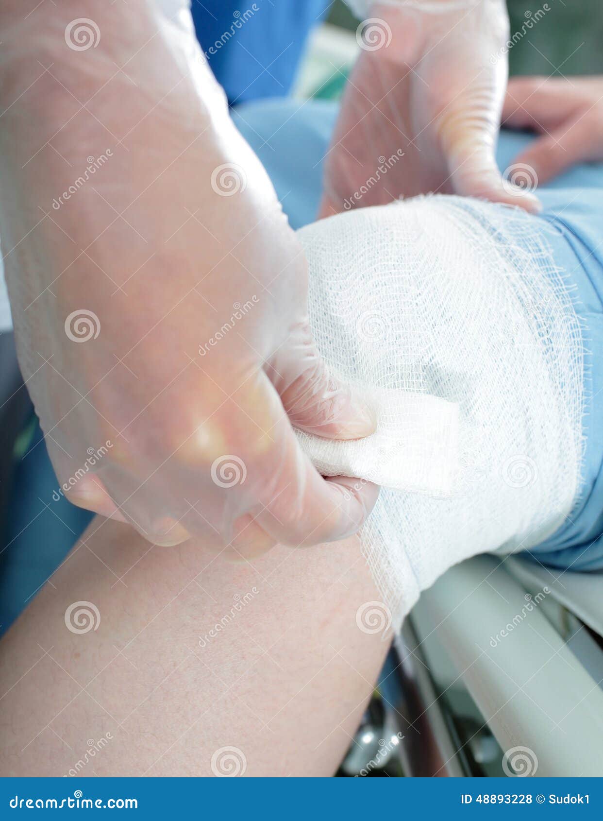 nurse provides first aid bandage
