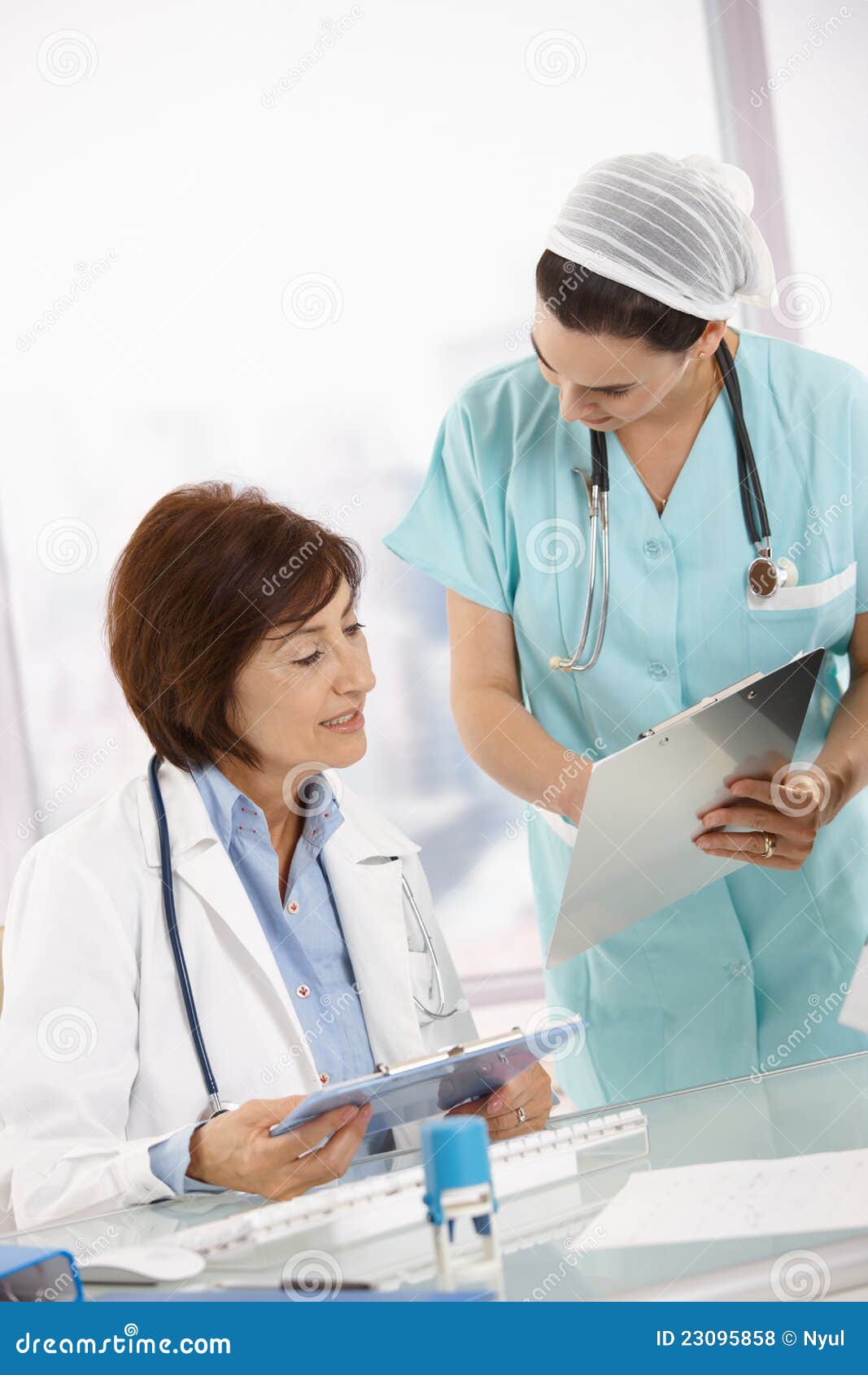 nurse and senior doctor analysing diagnosis