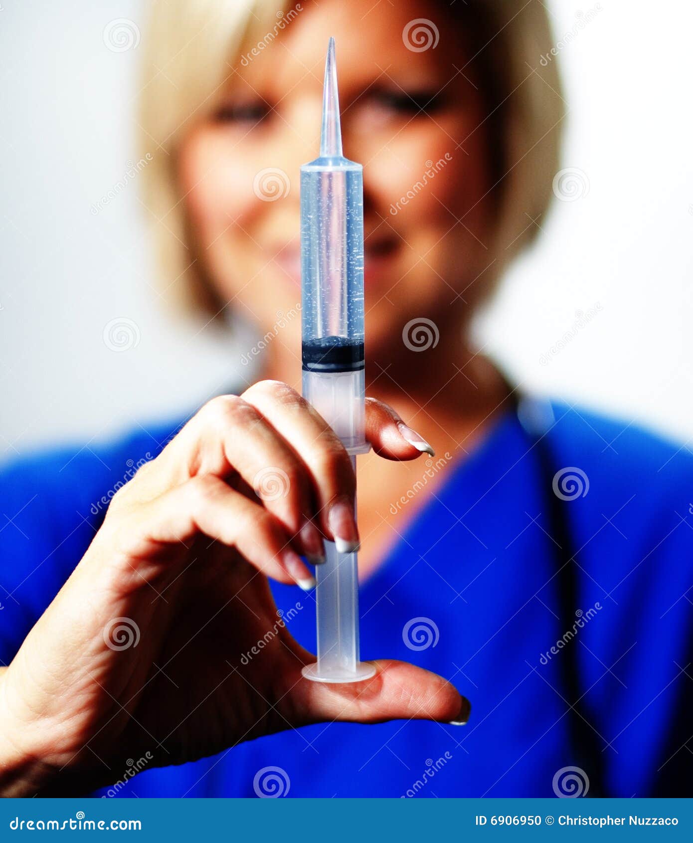 Nurse with Syringe stock photo. Image of happy, mature 6906950