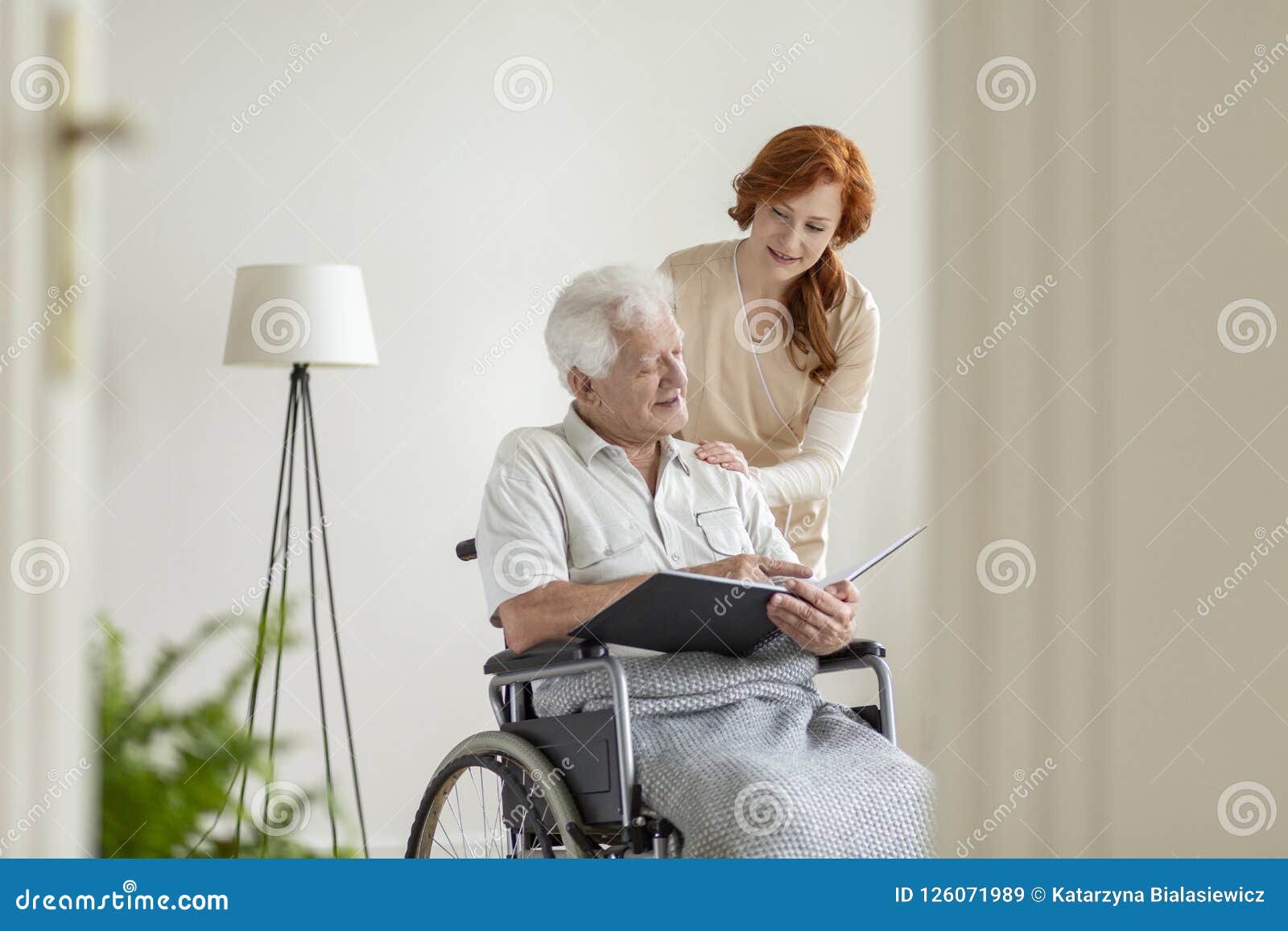 Elderly Man In Wheelchair Sitting Outside Nursing Home Stock Photo