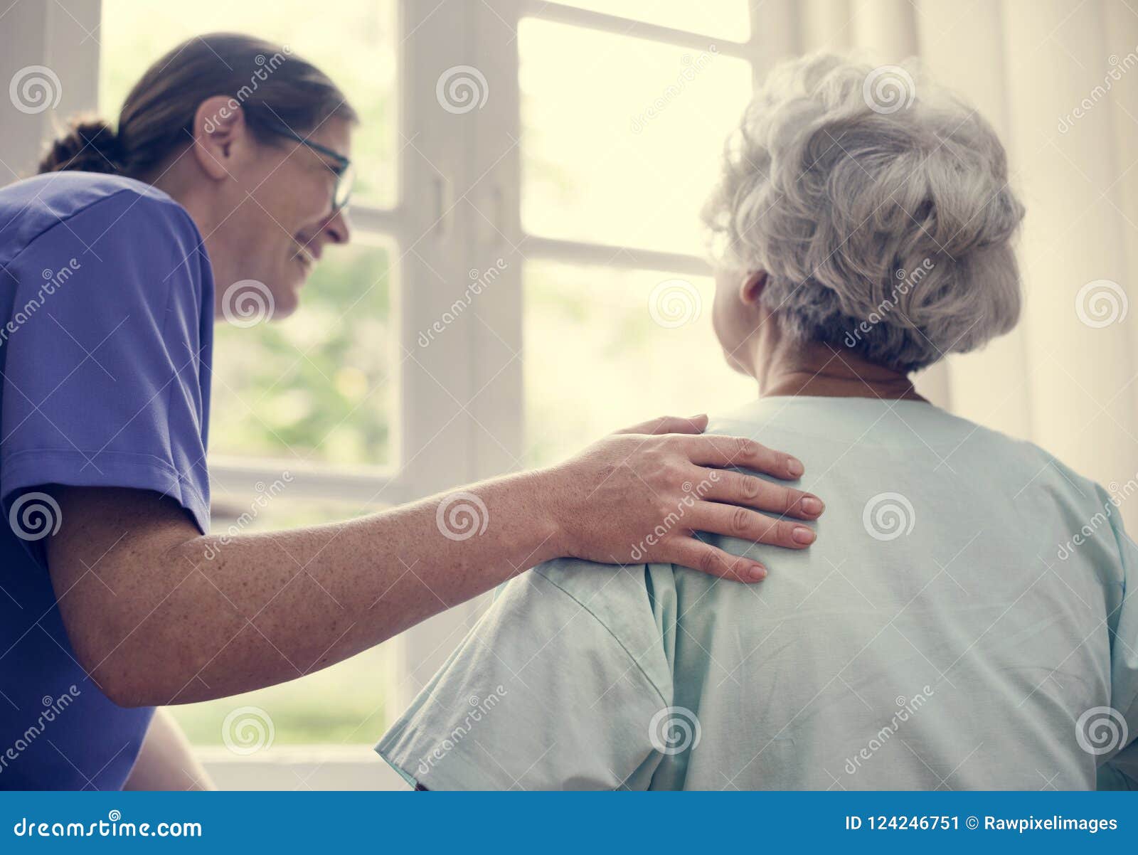 nurse taking care of an old woman