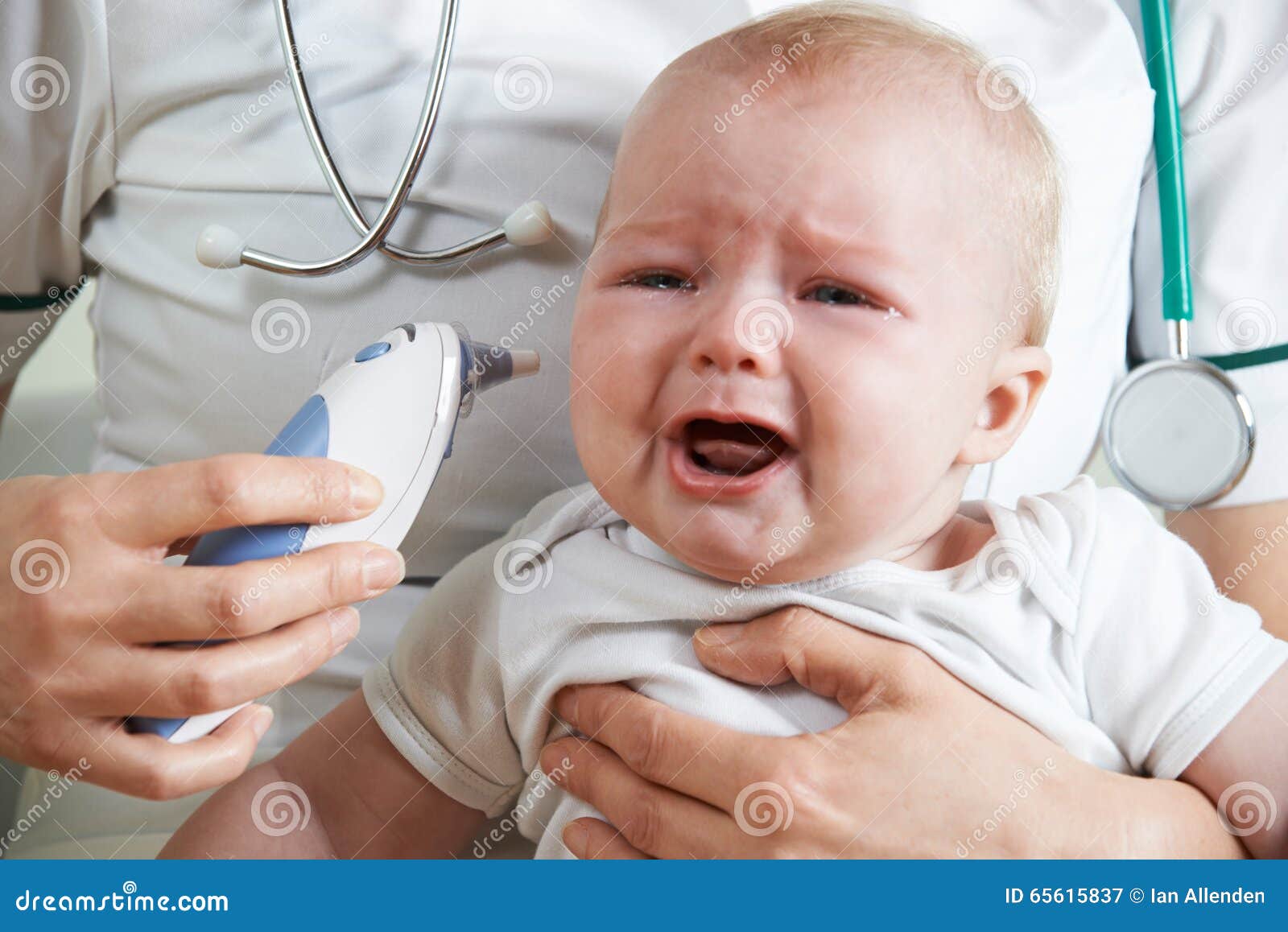 Nurse Taking Crying Baby S Temperature with Digital Thermometer Stock