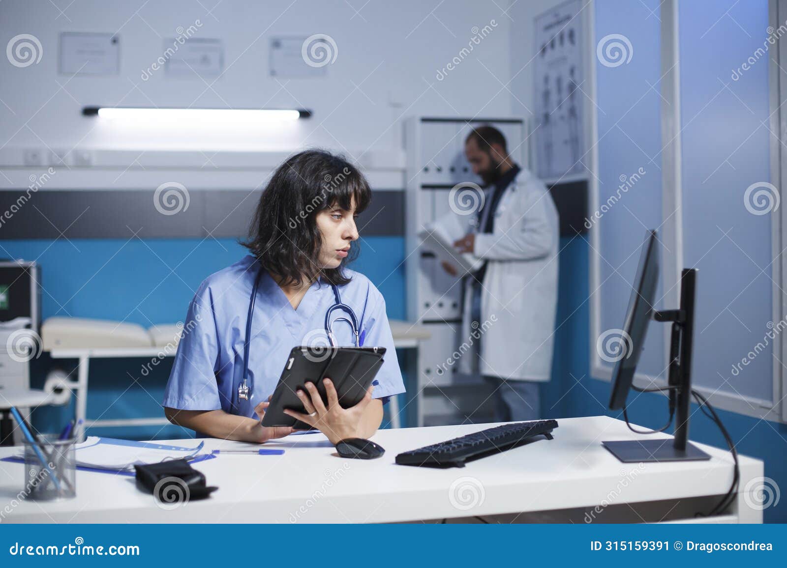 nurse using smart tablet for checkups