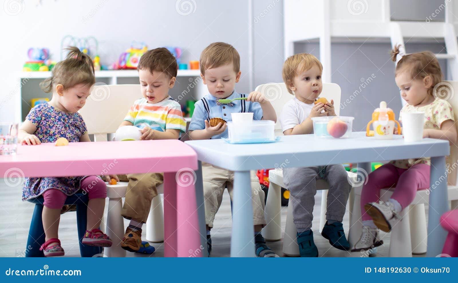nursery babies eating food. kids have lunch in daycare