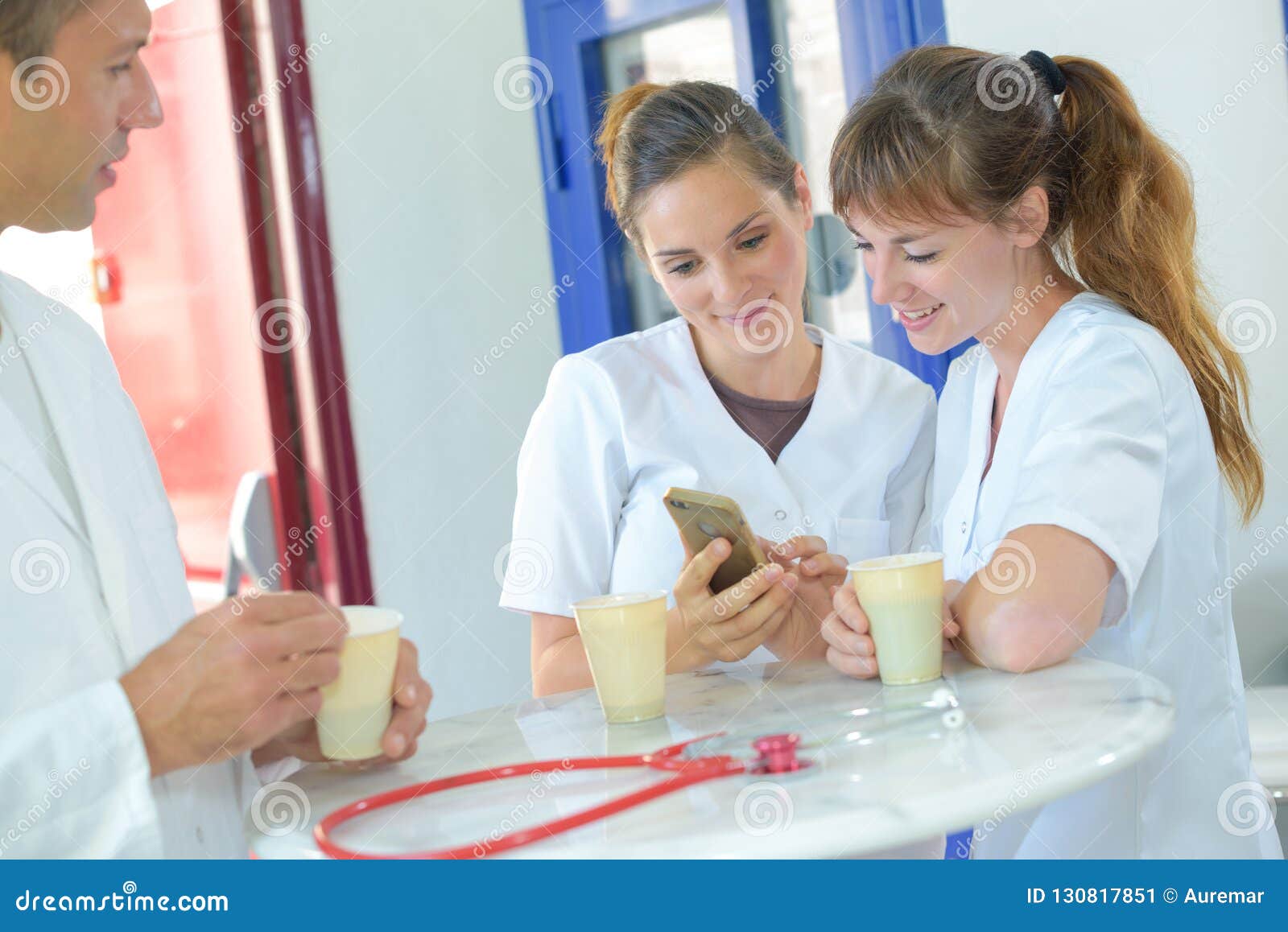 Nurses on Tea Break Looking at Smartphone Stock Image Image of