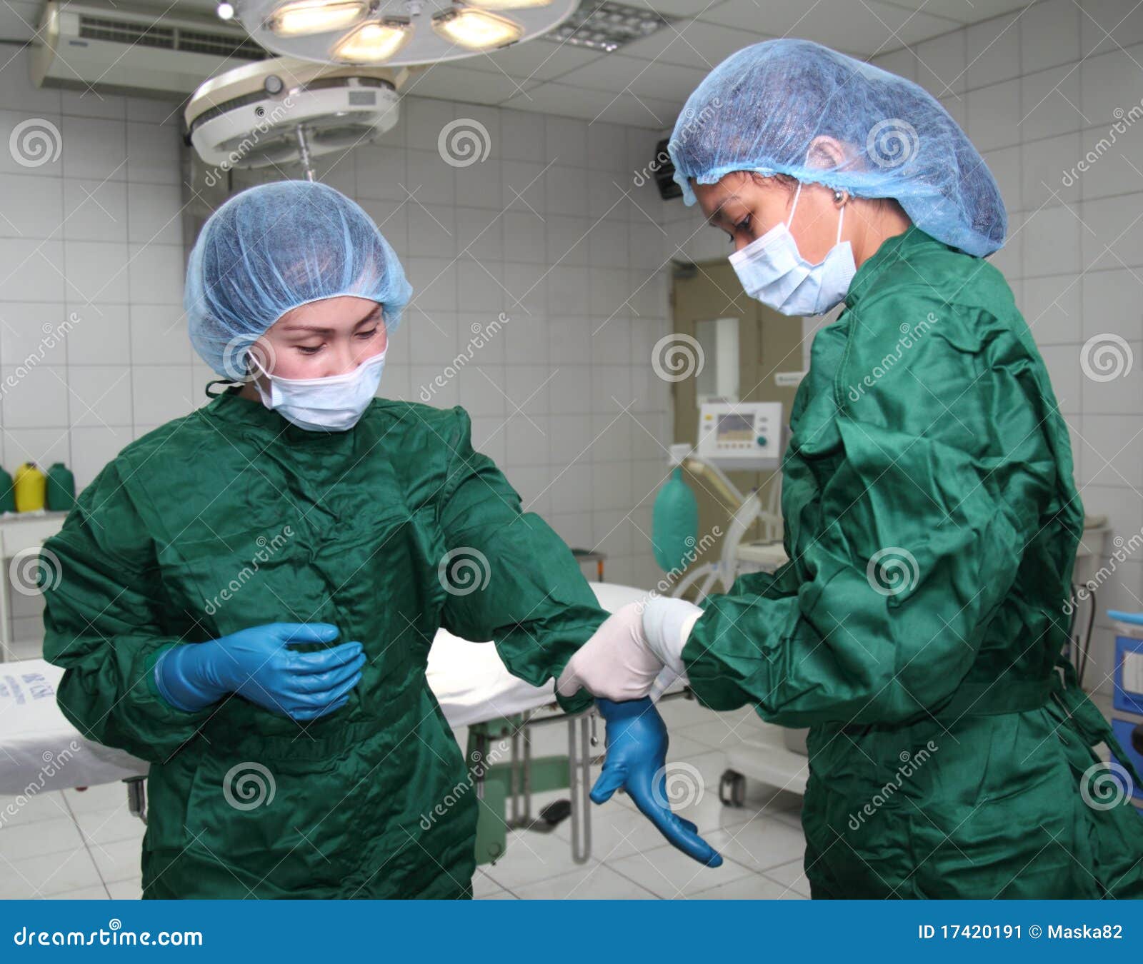 Nurses wearing gloves stock image. Image of gloves, young 17420191