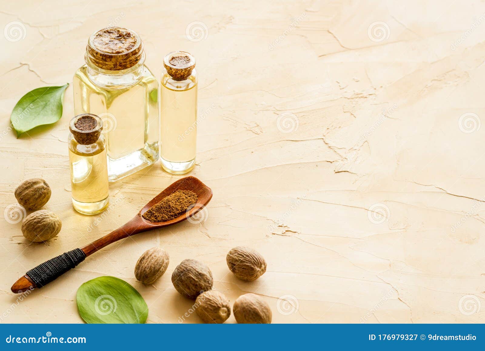 Nutmeg Oil Perfume Ingredient on Beige Background Copy Space Stock