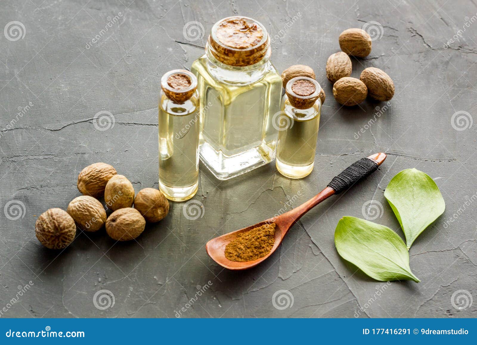 Nutmeg Oil Perfume Ingredient on Grey Background Stock Image