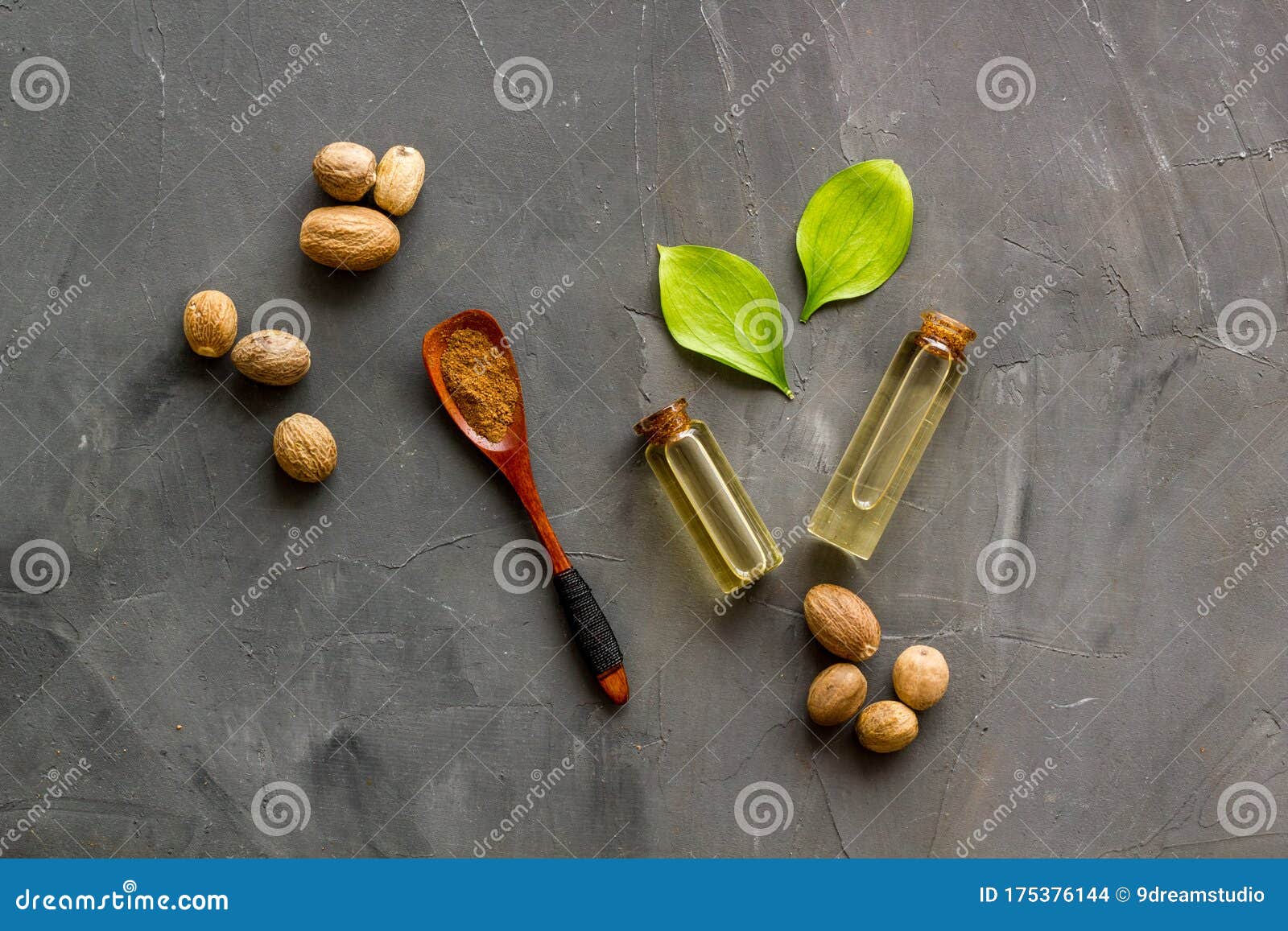 Nutmeg Oil Perfume Ingredient on Grey Background Topdown Stock