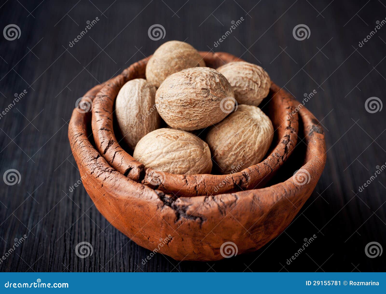 Nutmeg in a vintage bowl stock image. Image of cuisine 29155781