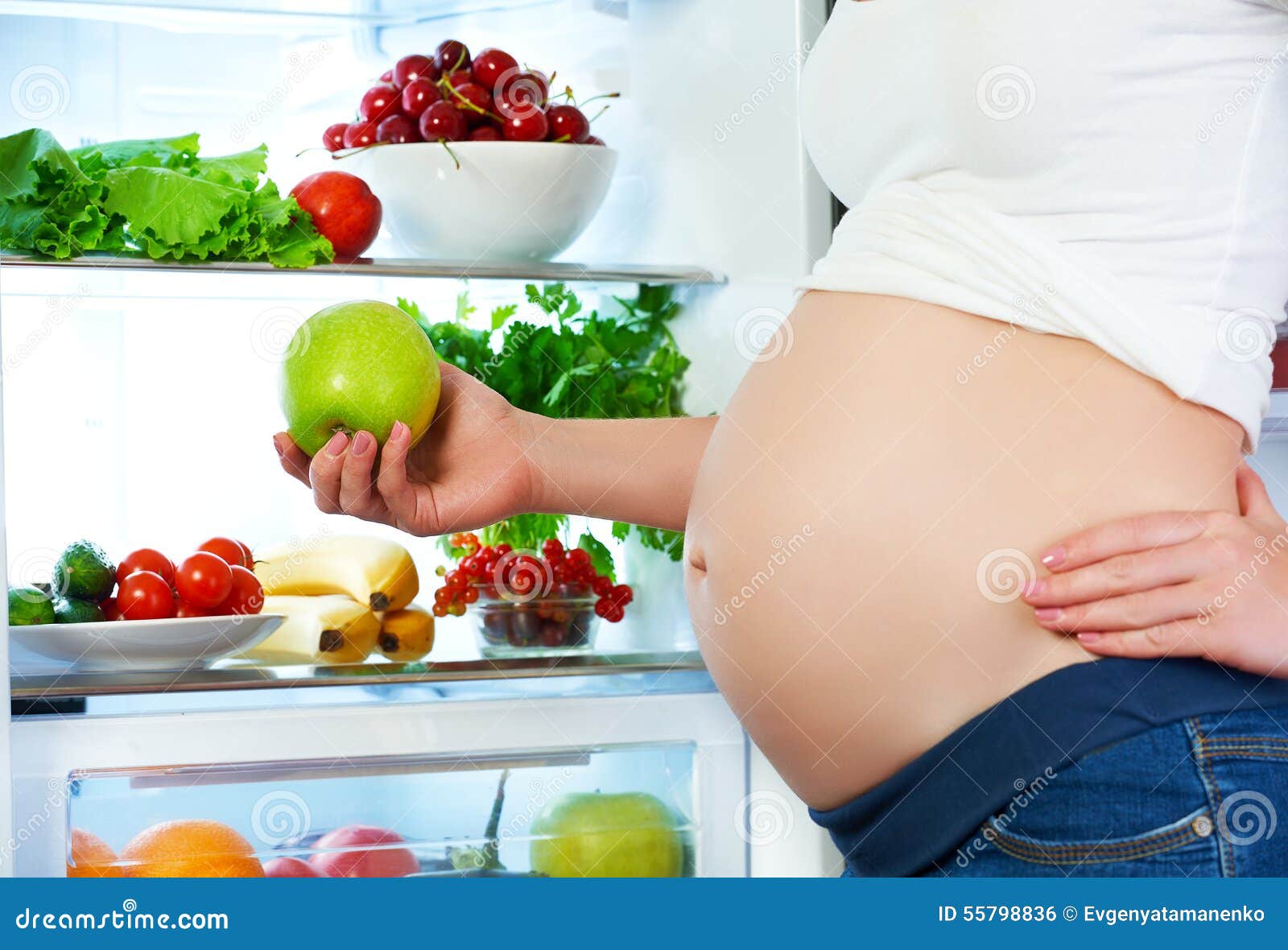 nutrition and diet during pregnancy. pregnant woman with fruits