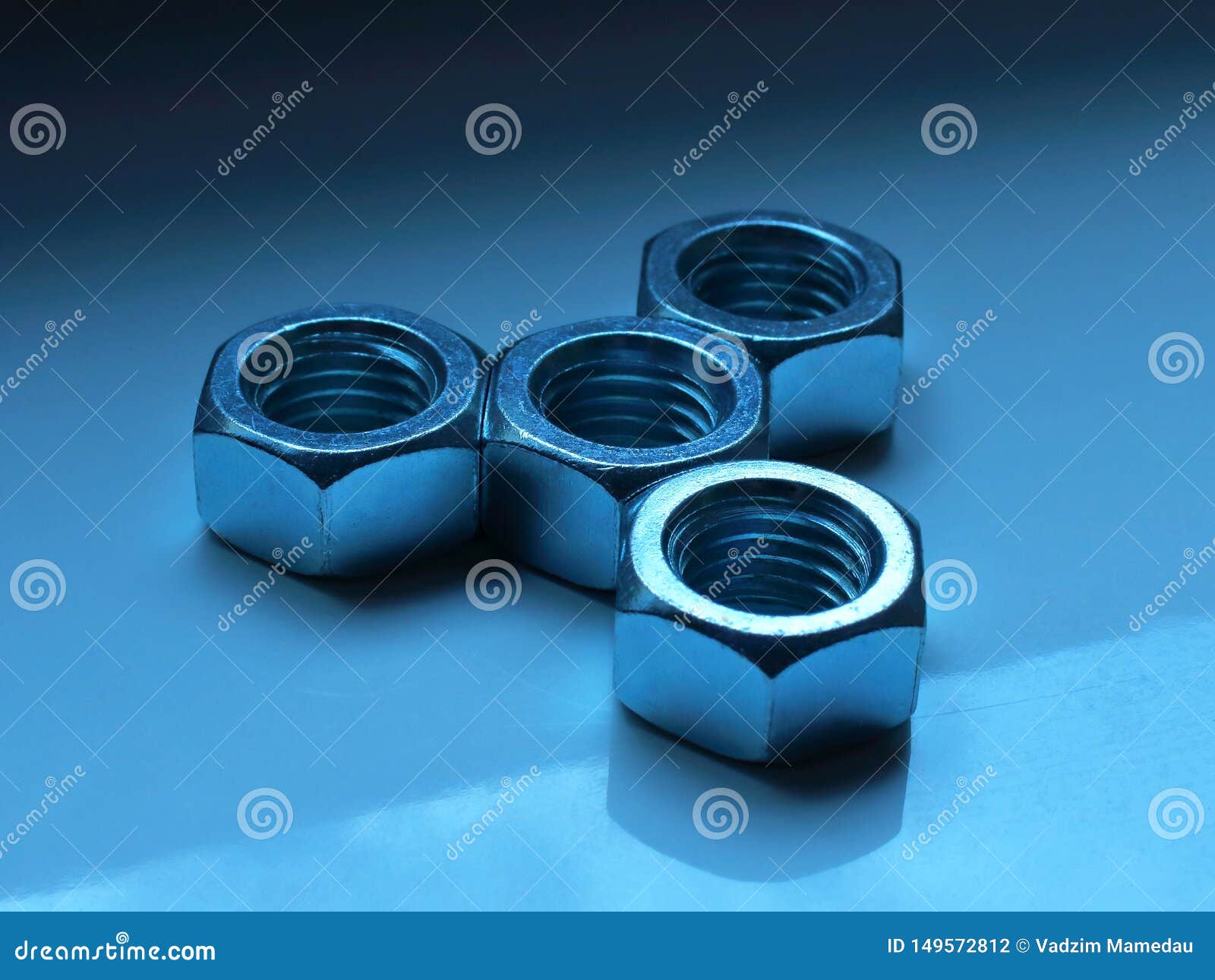 Nuts and Bolts in the Form of a Figure on the Stock Photo Image of