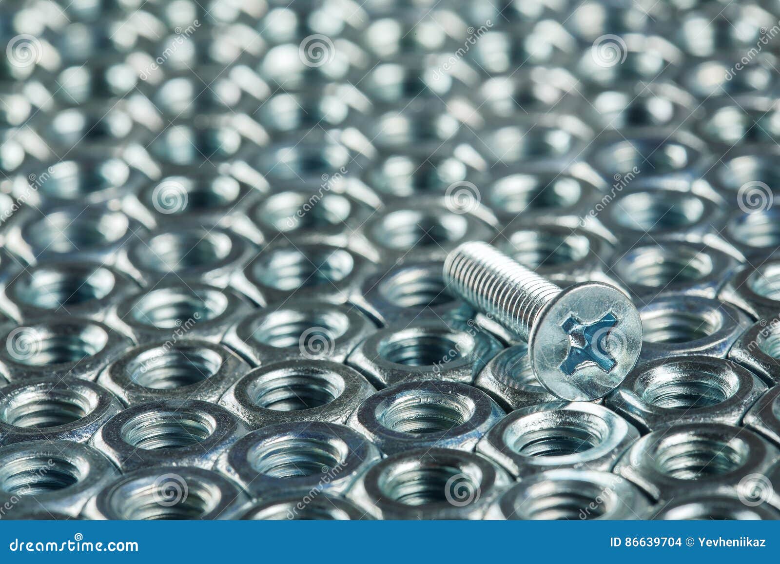 Nuts, Bolts, Screws on a Dark Concrete Background Stock Photo Image