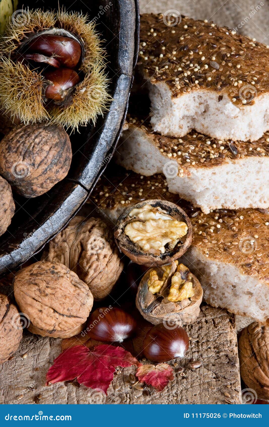 Nuts, chestnuts and bread stock photo. Image of leaves 11175026