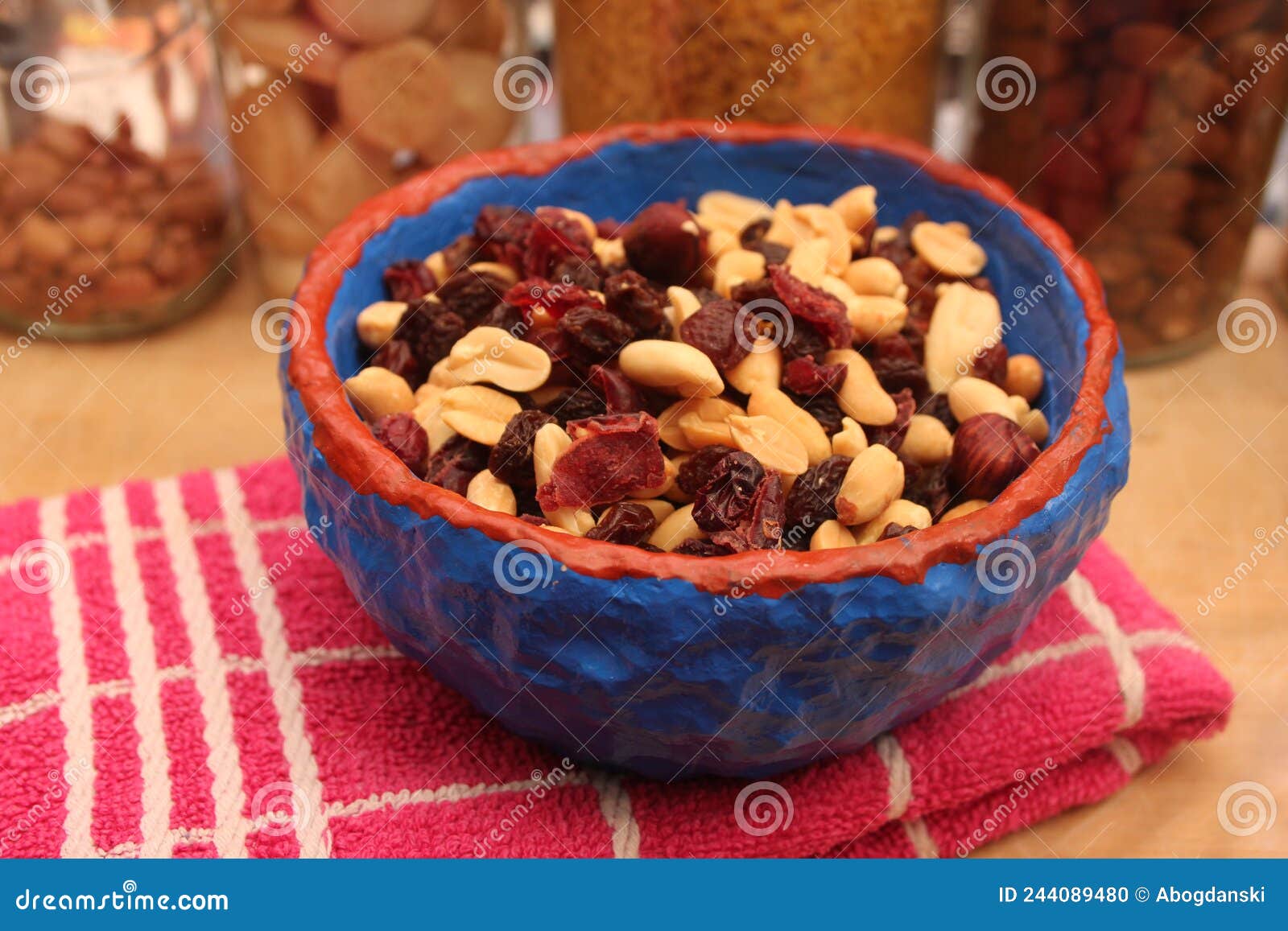 Nuts and raisins in a bowl stock photo. Image of nuts 244089480
