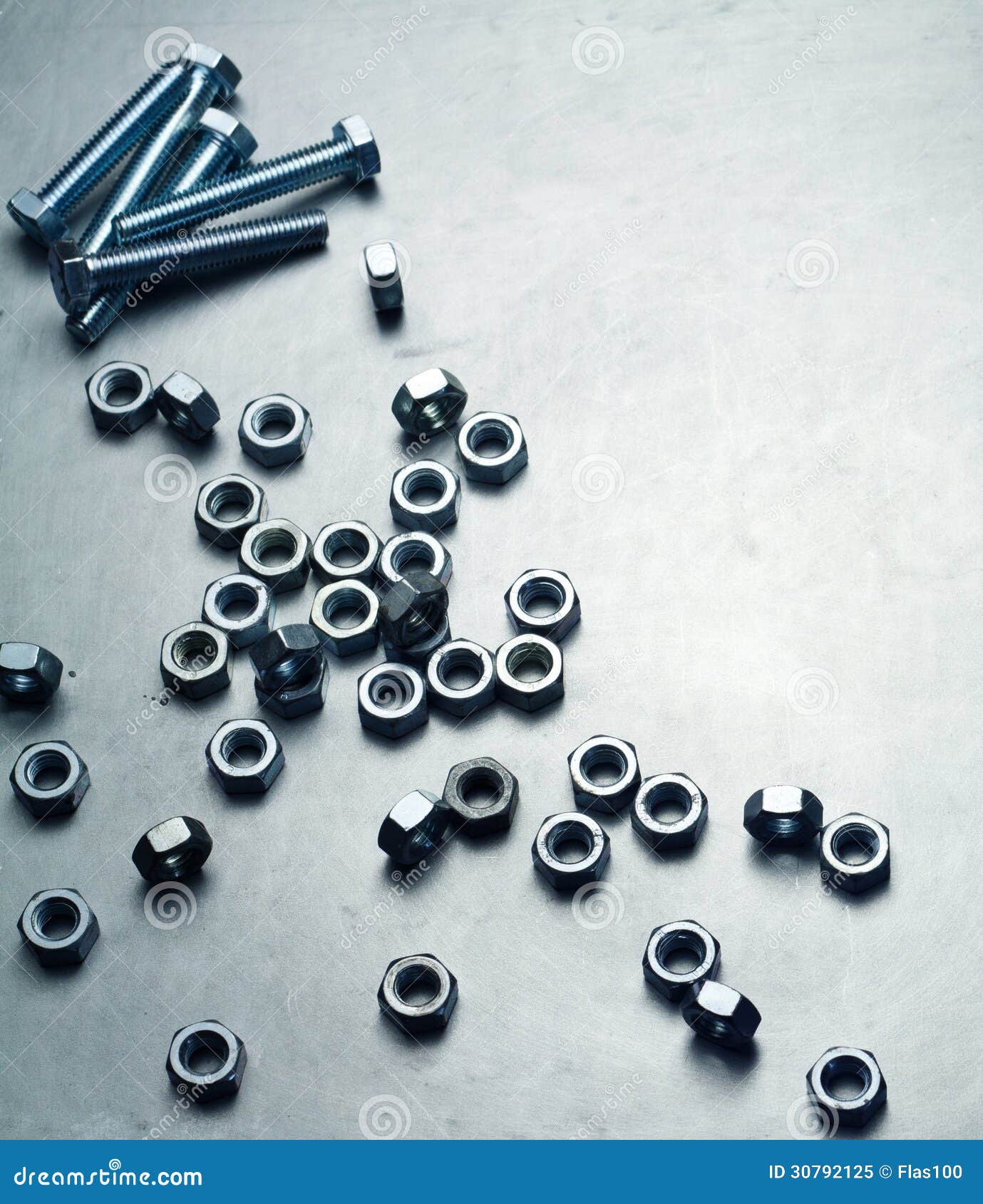 Nuts and Screws on a Metal Plate Stock Image Image of shiny, spanner