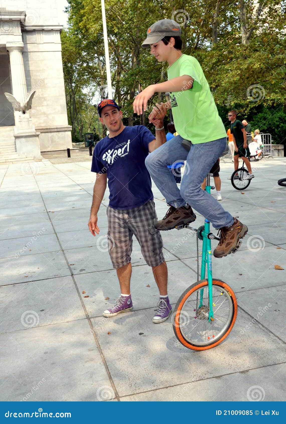 NYC Coach Aiding Unicycle Rider Editorial Image Image of young