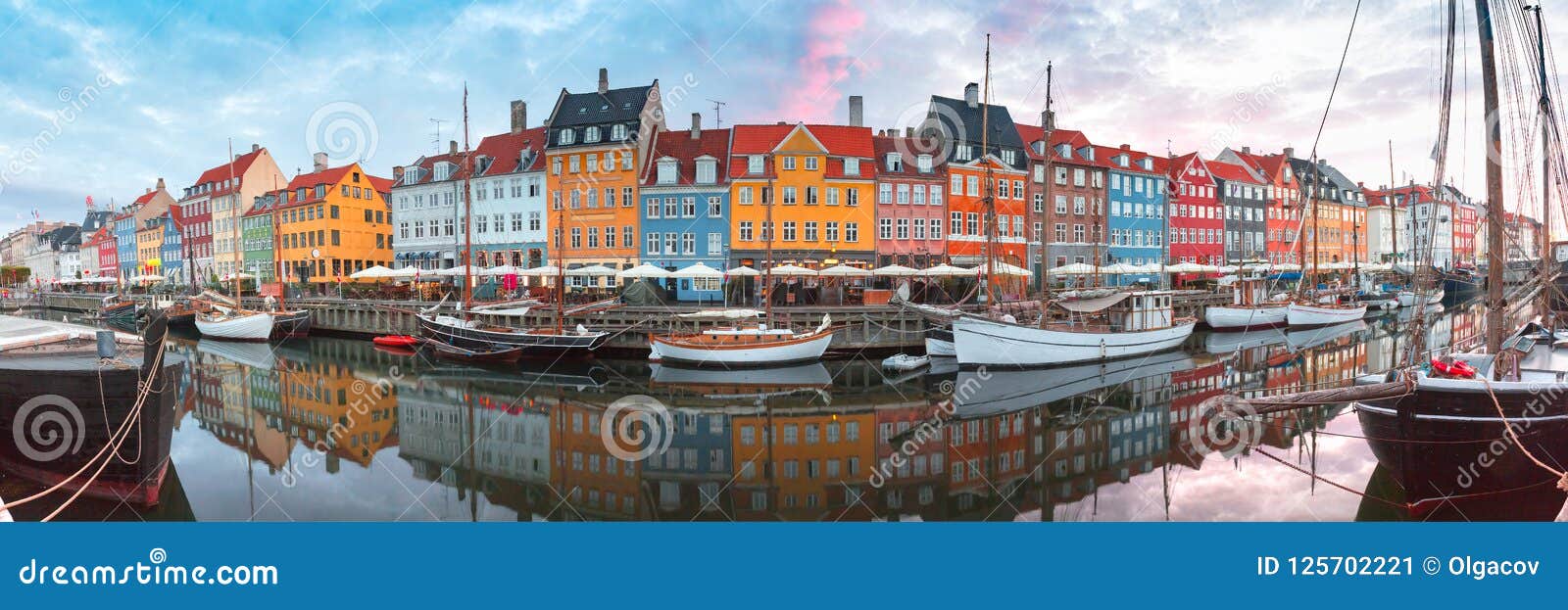 nyhavn at sunrise in copenhagen, denmark.