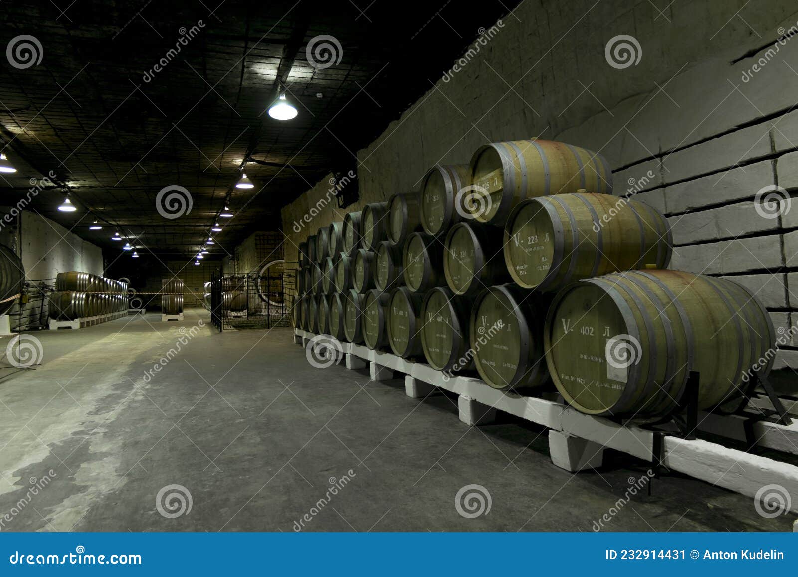 Oak Barrels with Wine in the Cellars of the Inkerman Winery in the Crimea Editorial Photo
