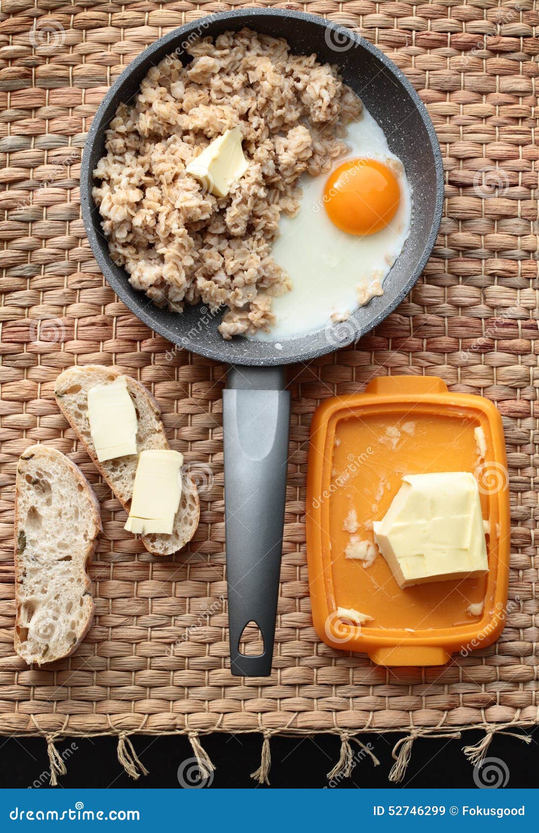 Oatmeal Breakfast with Scrambled Eggs and Bread and Butter Stock Image