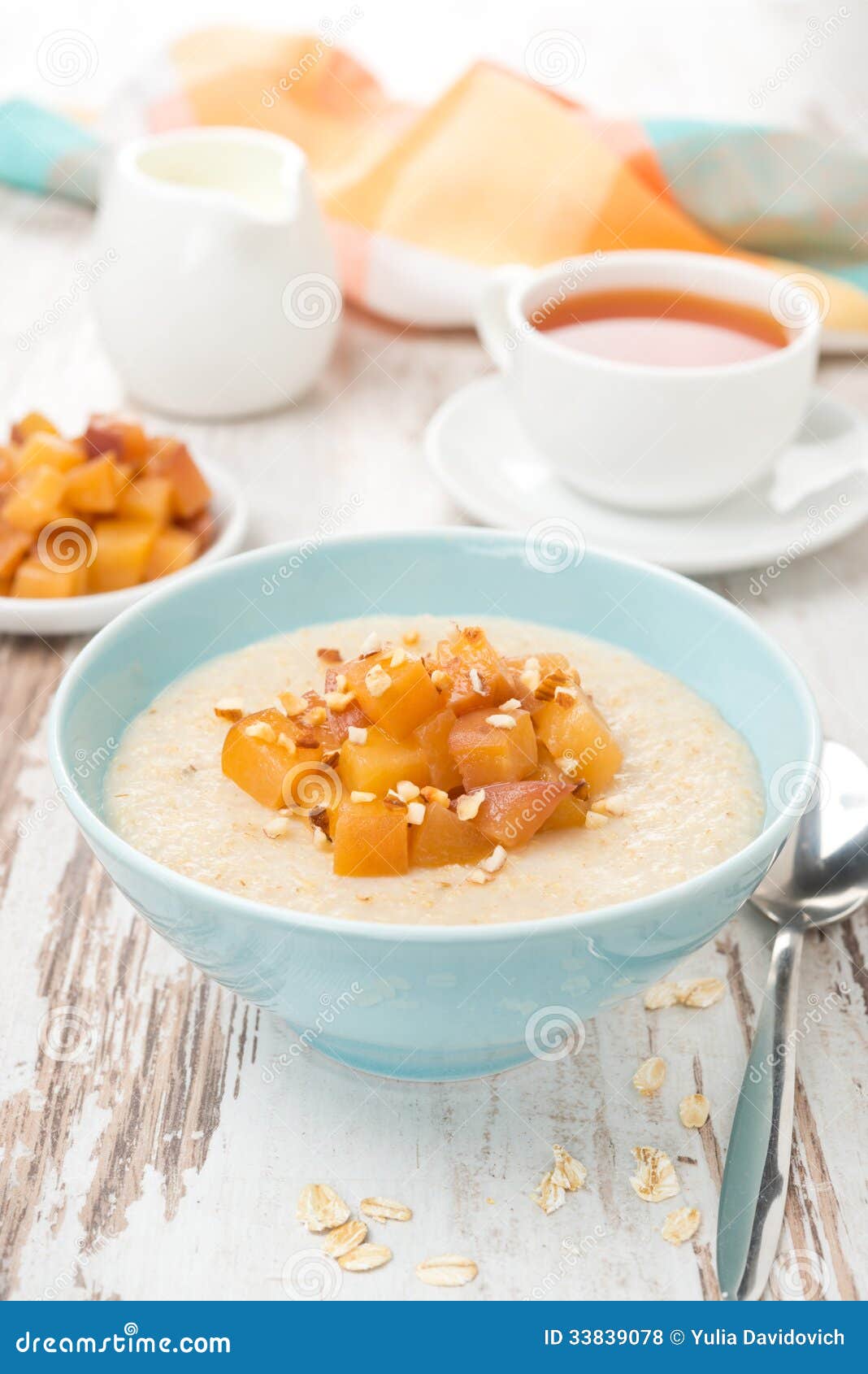 Oatmeal with Caramelized Peaches, Tea and Yogurt for Breakfast Stock