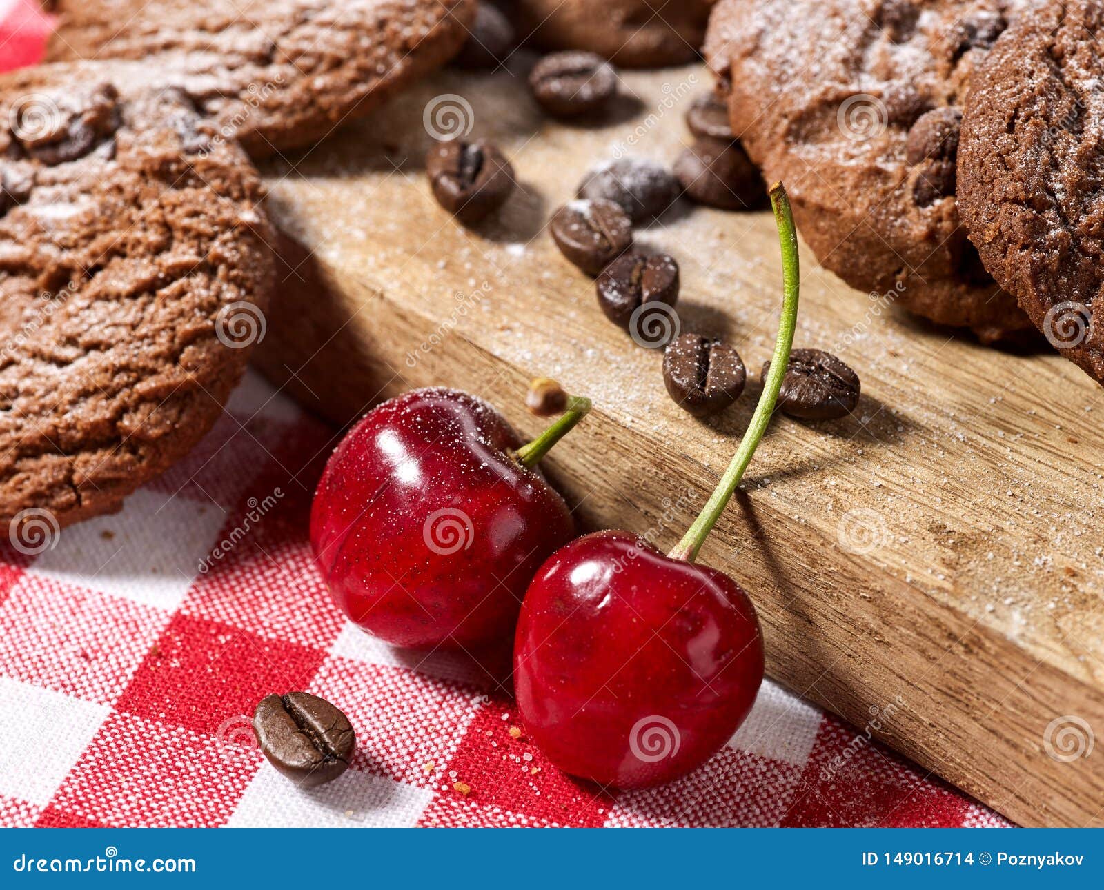 oatmeal chocolate cookies with coffee grains and cherry. sun flare