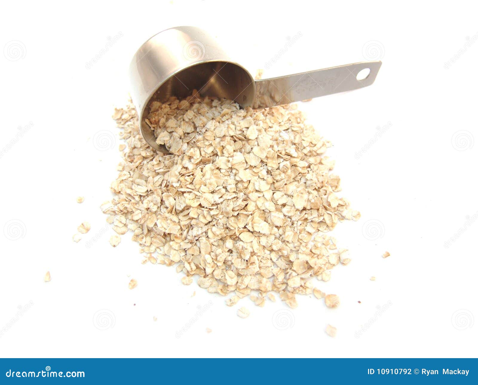 Oatmeal and measuring cup stock photo. Image of food 10910792