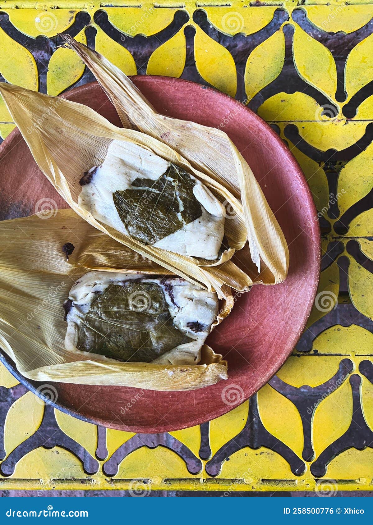 oaxacan tamales with hoja santa wrapped on the outside of the masa