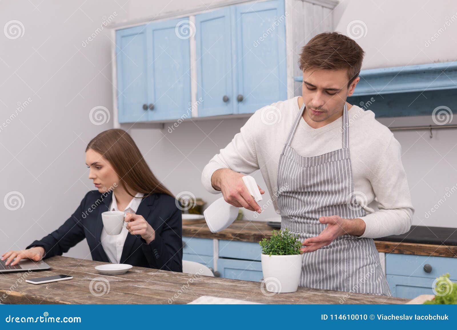 Obedient Husband Taking Care Of Flowers Stock Photo Image